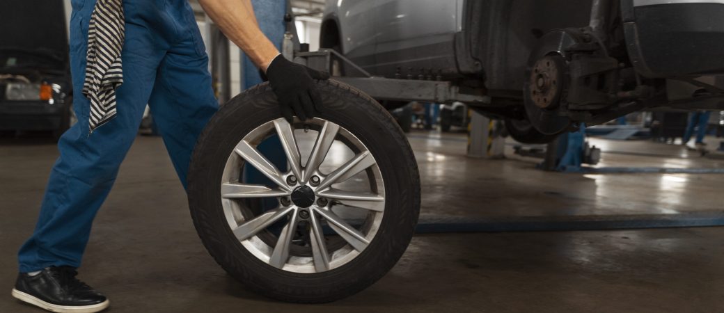 mechanic-working-shop-car